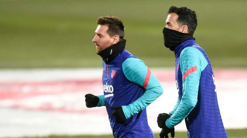 Lionel Messi and Sergio Busquets of FC Barcelona during the La Liga match between SD Huesca and FC Barcelona played at El Alcoraz Stadium on January 3, 2021 in Huesca, Spain.